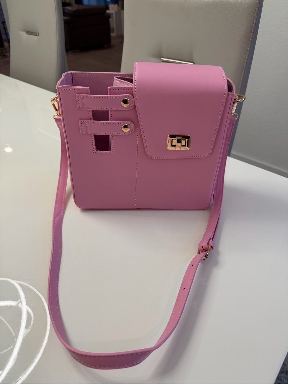 Women’s . Faux leather bag for water bottle with adjustable strap.